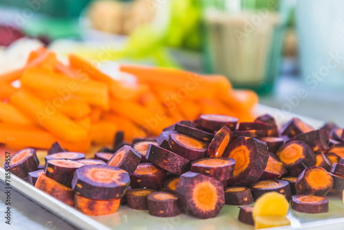 Various carrots and other vegetables cut into small pieces as a raw vegetable platter