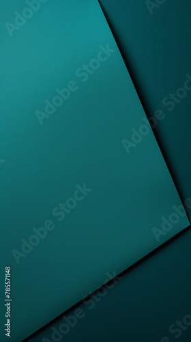 Teal background with dark teal paper on the right side, minimalistic background, copy space concept, top view