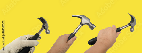 Set manual technical instruments hammers in craftsman's hand, tools quality craftsmanship and technical work on yellow background photo