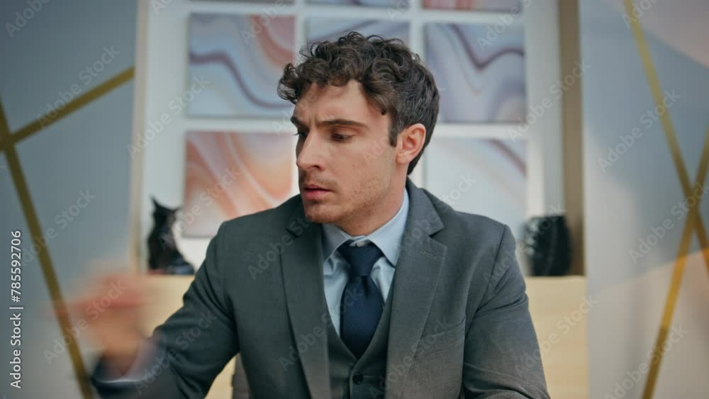 Furious manager arguing videocall at office pov portrait. Man examining papers Furious manager arguing videocall at office pov portrait. Man examining papers