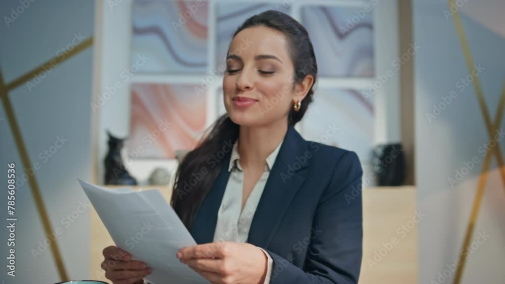 Smiling businesswoman greeting videocall office closeup. Coach holding documents Smiling businesswoman greeting videocall office closeup. Coach holding documents