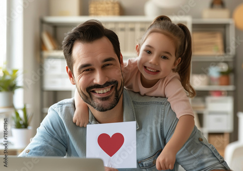 Man Holding Little Girl With Heart Card