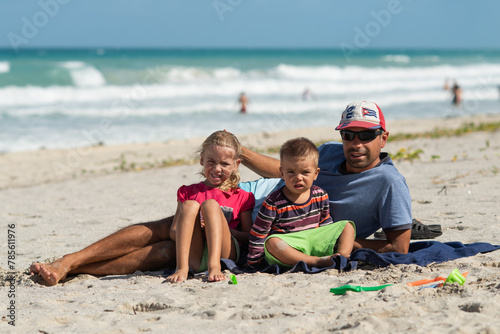 dad with children, playing with kids, family on the beach, swimming in the ocean, vacations in warm countries, Caribbean sea, Atlantic ocean, Cuba, childhood, parents, daughter, son