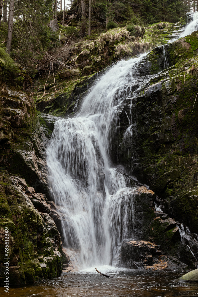 Waterfall. The river flows down from the rocks. Water on the rock.