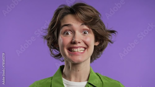 Friendly woman with short bob hair showing yes signal,approve.Smiling happy lady photo