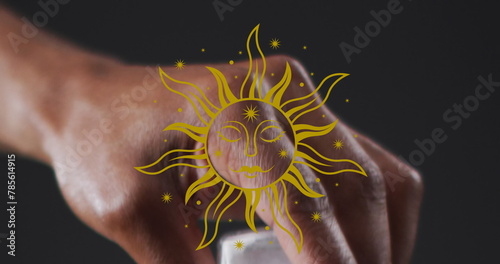 Image of sun icon over moving hand