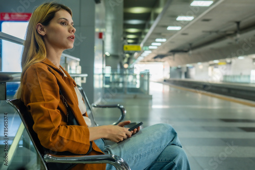 Young Woman Waiting Alone at Train Station.