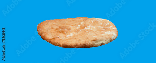 round georgian pita bread on a blue background. round flat bread on a light surface	 photo