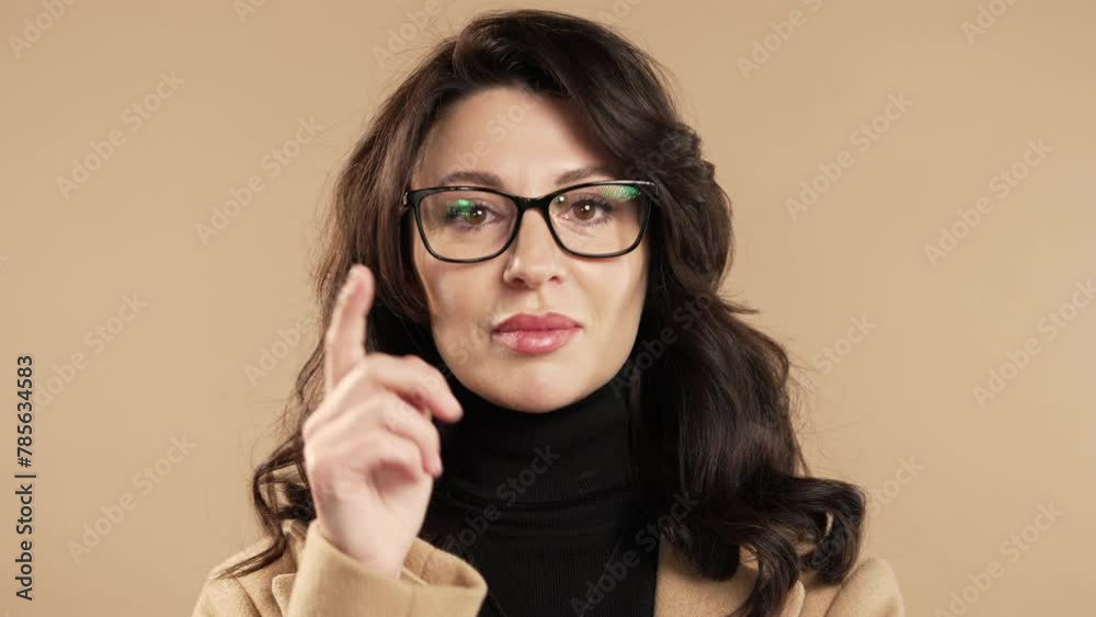 Pretty brainy businesswoman with gesture - you, think about it on beige studio.