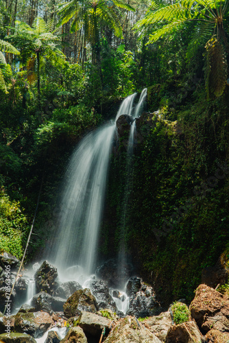This seasonal natural waterfall in the middle of the wilderness is called Grenjengan Kembar Waterfall. Detailed photos of a swift and beautiful waterfall with a slow shutter speed technique