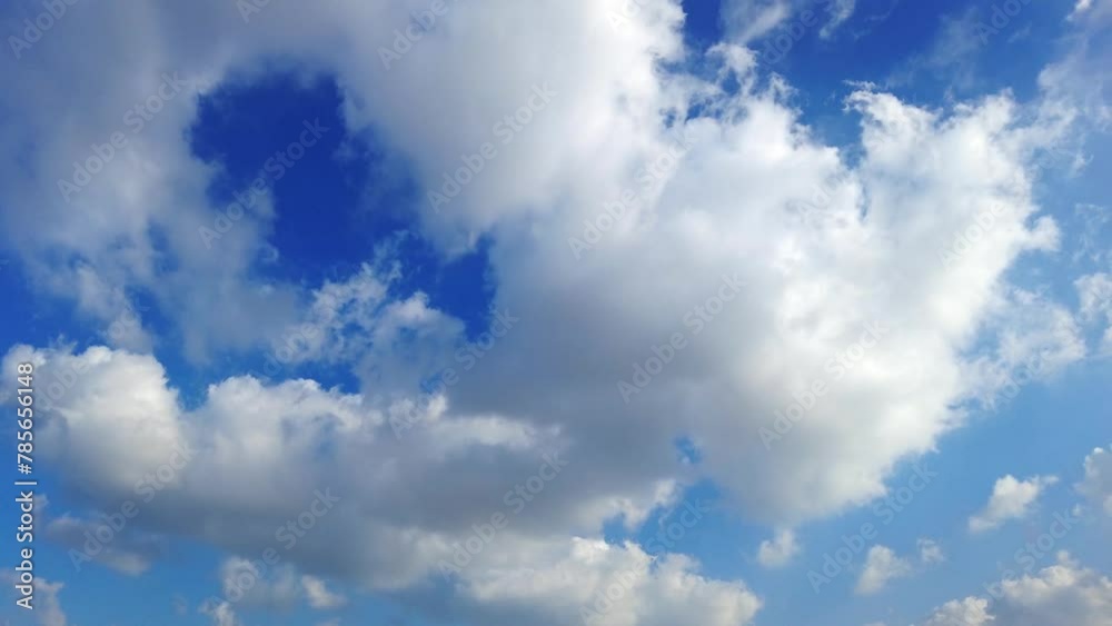 Cumulus clouds moving across the blue sky during summer day, timelapse Cumulus clouds moving across the blue sky during summer day, timelapse