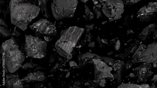 Super Slow Motion Shot of Coal Explosion Isolated On Black Background at 1000 fps. photo