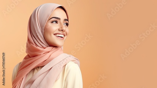happy arabian girl in bright colourful scarf on pastel background