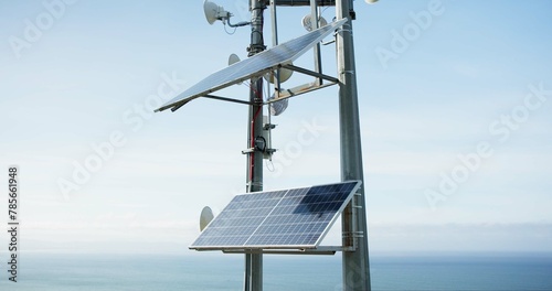 Solar panel, energy and roof with ocean, sky and horizon with sustainability, power or off grid development. Photovoltaic tech, electricity and outdoor with ecology for environment by sea in Tokyo