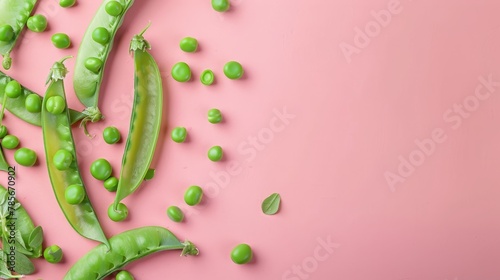 Green peas vegetable top view on the pastel background photo