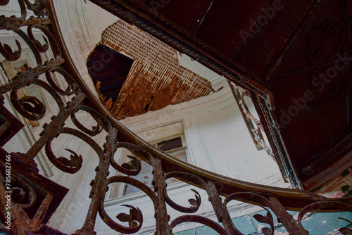 Wrought iron staircase in an old abandoned manor house