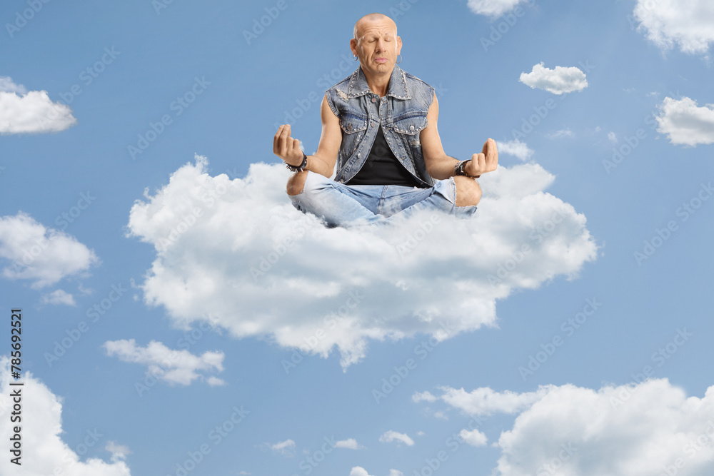 Bald man sitting corssed legged on a cloud Bald man sitting corssed legged on a cloud