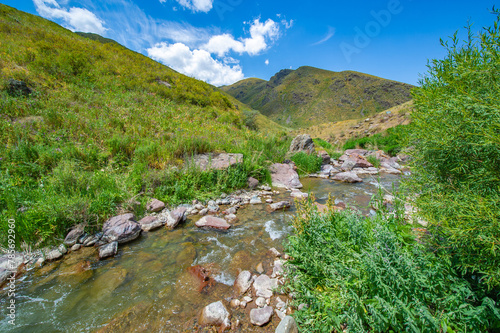 Enjoy the serene beauty of nature's masterpiece. See the river flow peacefully through the rocky canyon. Explore the majestic mountains surrounding this scenic destination.