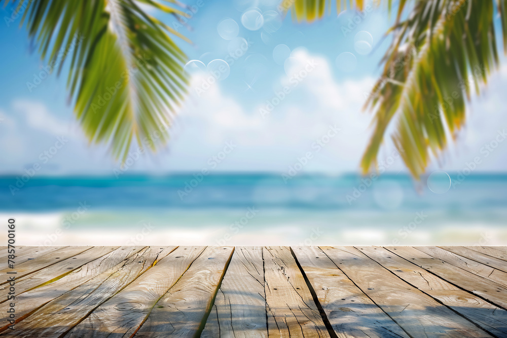 Empty wooden table top with blurred tropical beach background for product display montage
