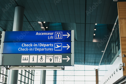 Directional signs to facilities in an airport. photo