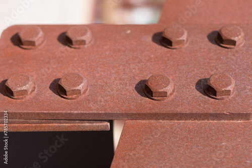 bolts screwed on steel plates