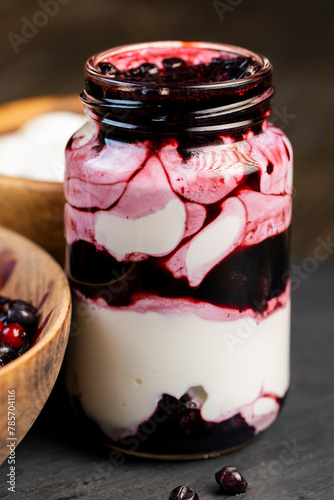 fresh creamy yogurt with berries and blueberry jam