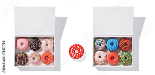 Decorated donuts in a box on white background