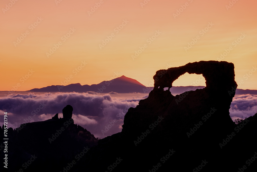 Sunset Silhouette of Teide and Roque Nublo Above Clouds Sunset Silhouette of Teide and Roque Nublo Above Clouds