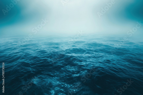 Mysterious Ocean with Fog Over Water Surface in Moody Blue Tones