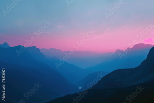 Majestic Mountain Range at Dusk with Pink Skies and Misty Valleys