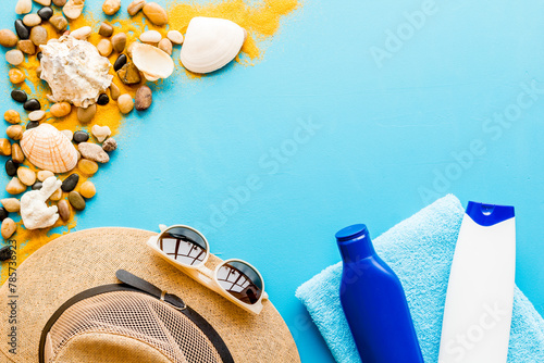 Sunbathe accessories with sea sand and shells, top view. Beach flat lay © 9dreamstudio