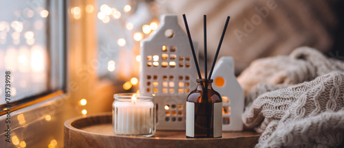 Banner. Christmas home aromatherapy. Cozy atmosphere, holiday spirit. Winter inspiration. Aroma diffuser with pine extract, organic essential oil, vanilla, gingerbread cookies, candles on wooden table