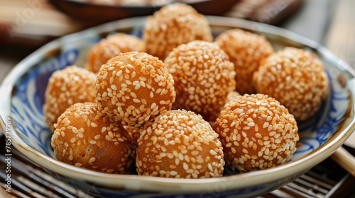 Traditional chinese sesame seed balls in porcelain bowl