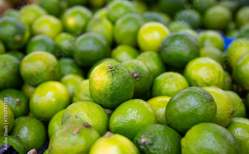 Closeup of green fresh and ripe Lime fruit at grocery store or market