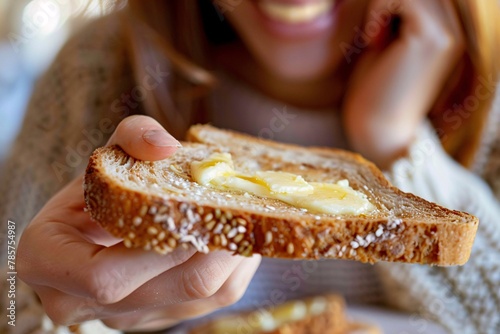 Macro shot of a woman relishing a slice of rich, buttery toast
