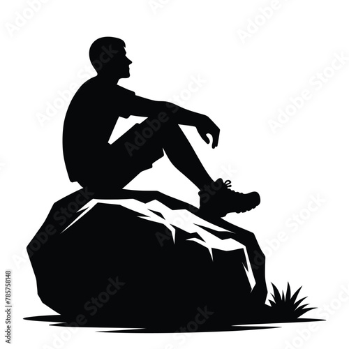 silhouette of a person sitting on a boulder isolated