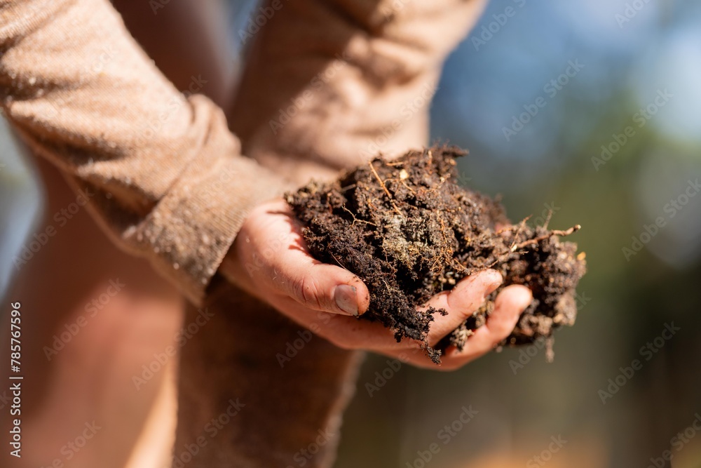 regenerative organic farmer, taking soil samples and looking at plant growth in a farm. practicing sustainable agriculture. regenerative organic farmer, taking soil samples and looking at plant growth in a farm. practicing sustainable agriculture.