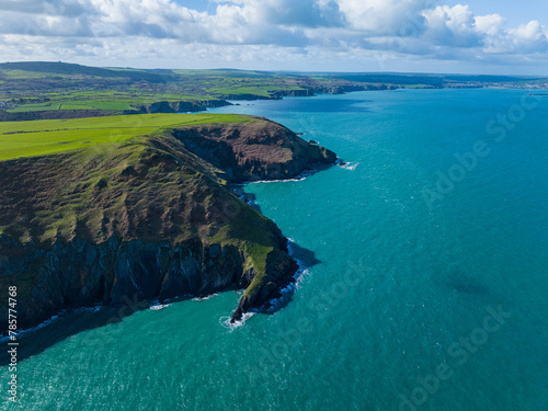 Aerial shot of Ynys Dinas headland and coastline looking towards Fishguard Bay, Pembrokeshire, West Wales photo