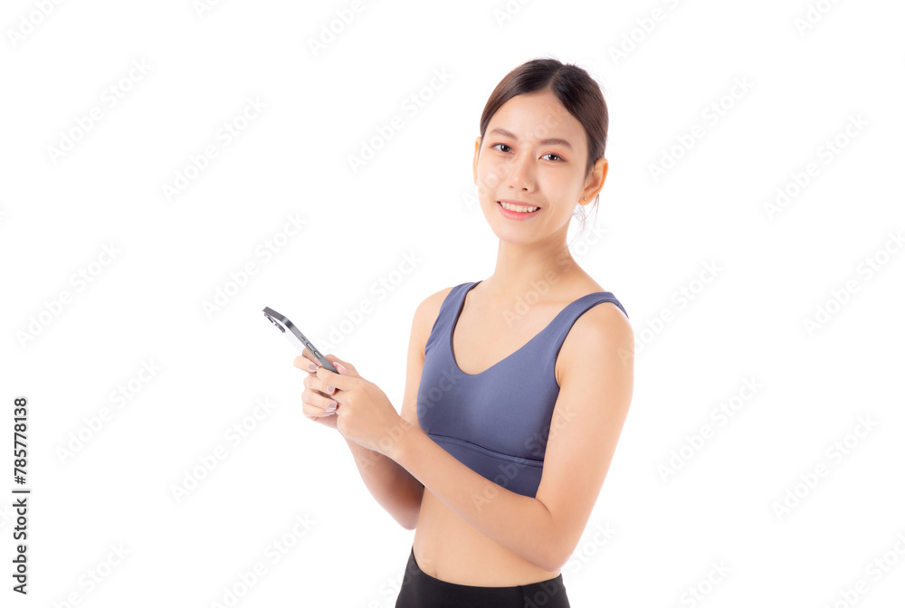 A fit young asian woman in sportswear using a smart phone, possibly managing her fitness routine isolated white background, active woman using smartphone in sportswear, sport and health. A fit young asian woman in sportswear using a smart phone, possibly managing her fitness routine isolated white background, active woman using smartphone in sportswear, sport and health.