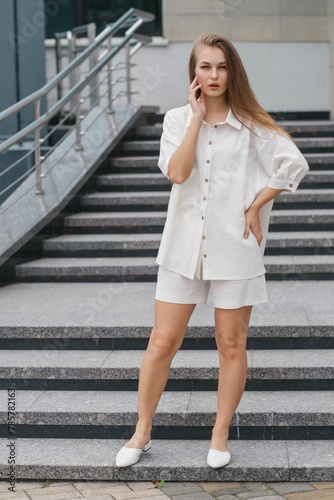 cute girl in a white summer outfit