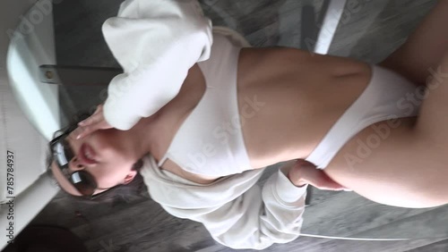 CFC2022VV  Ukrainian female model in casual setting dressed in white lingerie 4K in vertical format