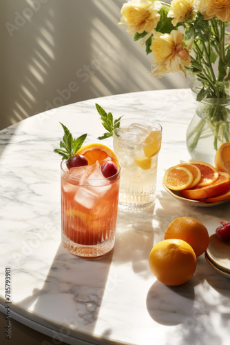 Brunch cocktails with berries and fruits on a marble countertop in a modern white kitchen © fahrwasser