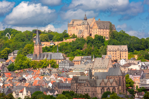 Marburg cityscape with the iconic castle perched above historical German buildings, Germany