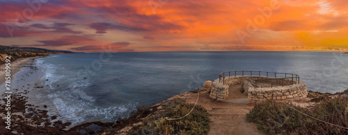 Sunset in a stone overlook that views Crystal Cove State Park Beach