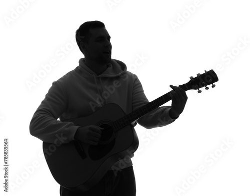 Silhouette of young man pla...