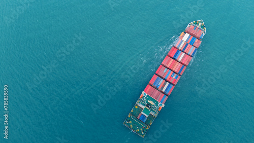 Top view Cargo Container ship the ocean ship carrying container and running for import export concept technology freight shipping by ship . aerial top of Container Vessel running in green sea.