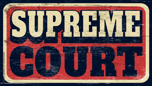 Aged and worn vintage supreme court sign on wood