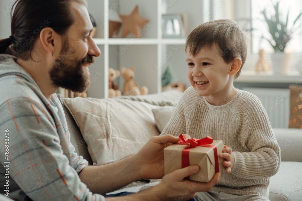 Father's day concept - child giving present to dad Father's day concept - child giving present to dad