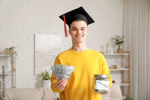 Smiling young man in gradua...