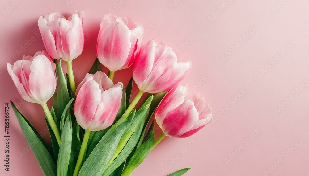 Beautiful composition spring flowers. Bouquet of pink tulips flowers on pastel pink background. Valentine's Day, Easter, Birthday, Happy Women's Day, Mother's Day. Flat lay, top view, copy space Beautiful composition spring flowers. Bouquet of pink tulips flowers on pastel pink background. Valentine's Day, Easter, Birthday, Happy Women's Day, Mother's Day. Flat lay, top view, copy space